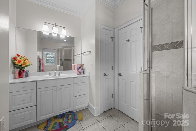 123 Yellow Jacket Cir, Mooresville, NC 28117 - bathroom with crown molding, a stall shower, vanity, and tile patterned floors