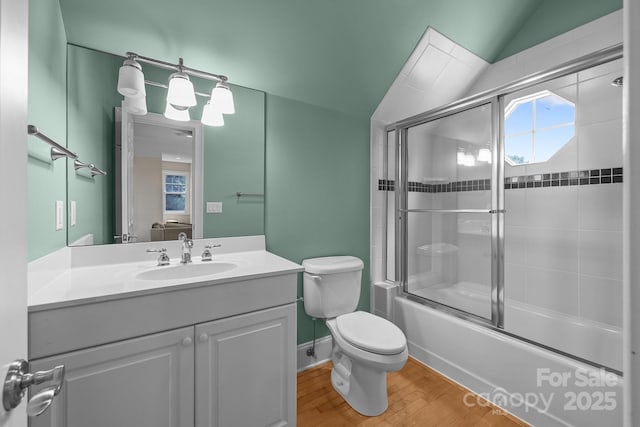 123 Yellow Jacket Cir, Mooresville, NC 28117 - full bath featuring vaulted ceiling, enclosed tub / shower combo, vanity, and wood finished floors