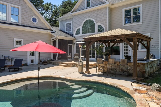 123 Yellow Jacket Cir, Mooresville, NC 28117 - swimming pool with a gazebo, a patio area, and a sunroom
