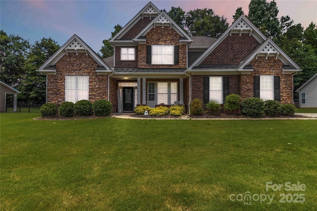 1041 Verbena Ct, Tega Cay, SC 29708 - craftsman-style house featuring a yard, stone siding, a standing seam roof, and a metal roof