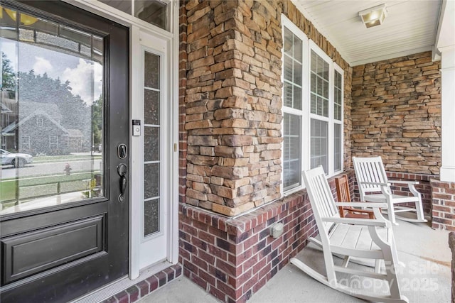 1041 Verbena Ct, Tega Cay, SC 29708 - doorway to property with a porch and brick siding