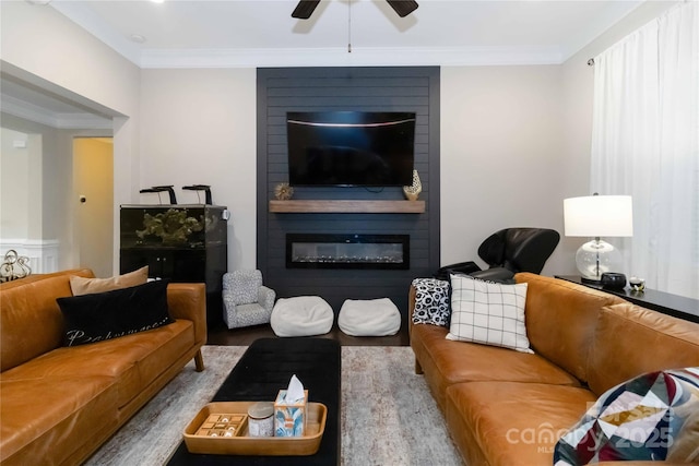 1041 Verbena Ct, Tega Cay, SC 29708 - living room featuring a fireplace, wood finished floors, ceiling fan, and crown molding