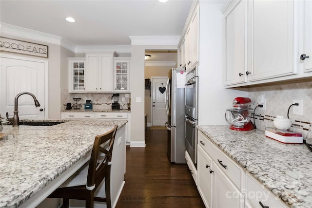 1041 Verbena Ct, Tega Cay, SC 29708 - kitchen with tasteful backsplash, white cabinetry, crown molding, freestanding refrigerator, and glass insert cabinets