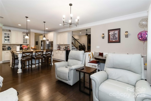 1041 Verbena Ct, Tega Cay, SC 29708 - living area with ornamental molding, stairway, recessed lighting, dark wood-style floors, and a chandelier