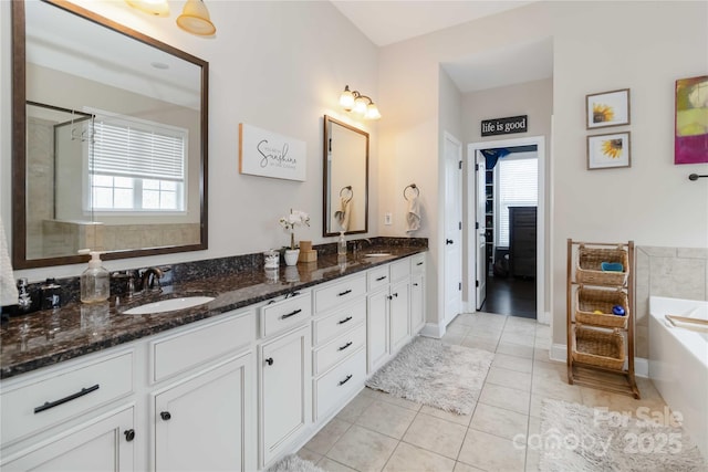 1041 Verbena Ct, Tega Cay, SC 29708 - bathroom featuring double vanity, a garden tub, tile patterned flooring, and a shower