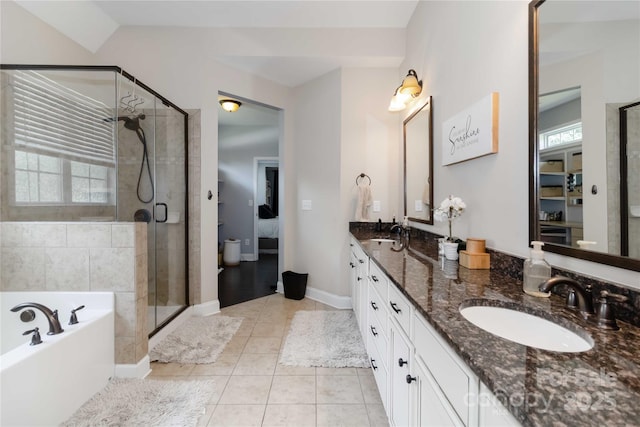 1041 Verbena Ct, Tega Cay, SC 29708 - full bathroom featuring double vanity, a garden tub, a shower stall, and tile patterned flooring