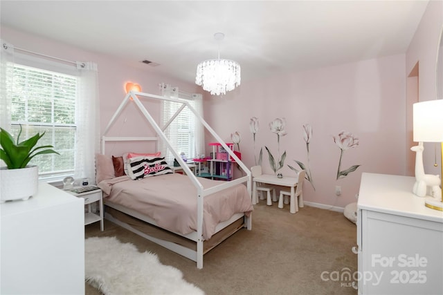 1041 Verbena Ct, Tega Cay, SC 29708 - bedroom featuring a chandelier and light carpet