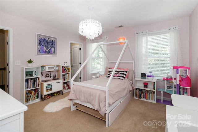 1041 Verbena Ct, Tega Cay, SC 29708 - bedroom featuring a chandelier and light carpet