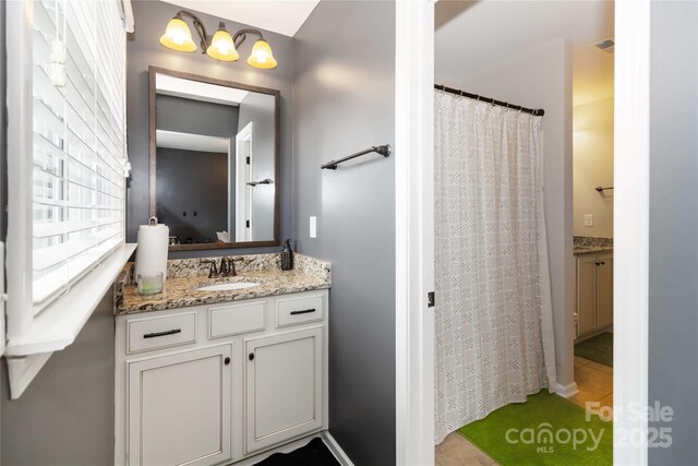 1041 Verbena Ct, Tega Cay, SC 29708 - bathroom with vanity and curtained shower