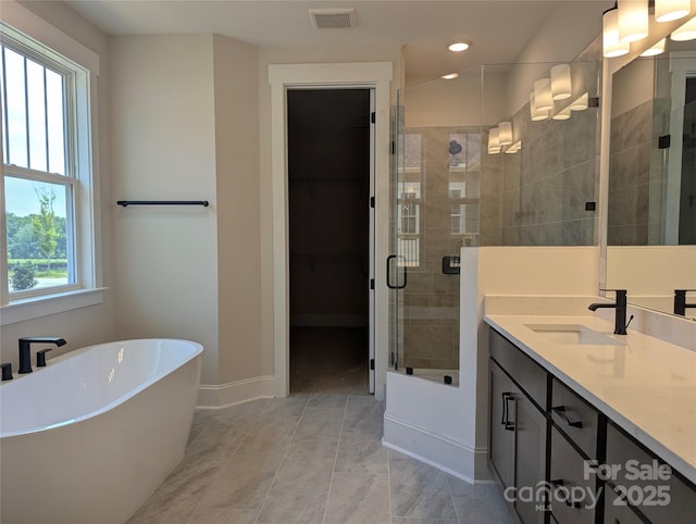 105 Macland Ln Unit 540, Rock Hill, SC 29730 - full bathroom featuring a shower stall, a freestanding tub, vanity, recessed lighting, and a walk in closet