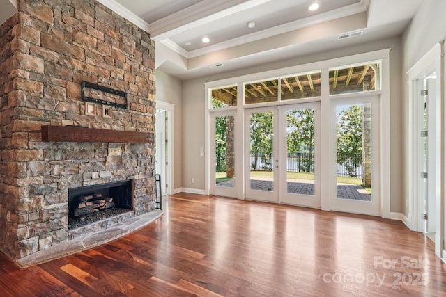 3229 Lake Pointe Dr, Belmont, NC 28012 - unfurnished living room with crown molding, a stone fireplace, wood finished floors, and a raised ceiling