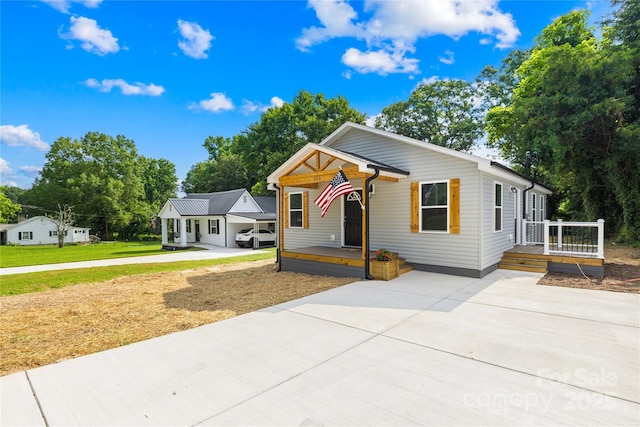 500 N Dr, Cherryville, NC 28021 - view of front of property with driveway, a front yard, and a porch