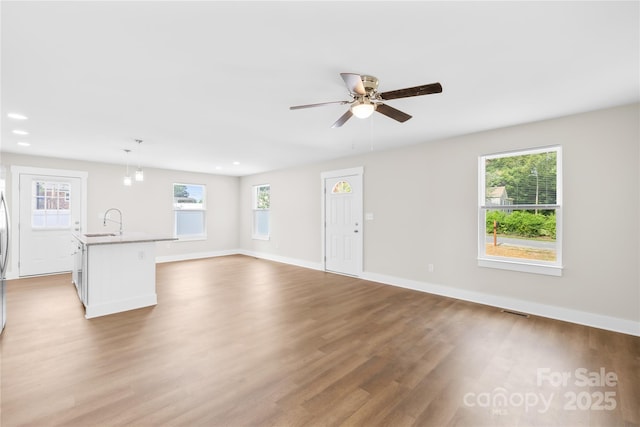 500 N Dr, Cherryville, NC 28021 - unfurnished living room featuring healthy amount of natural light, wood finished floors, a ceiling fan, and recessed lighting