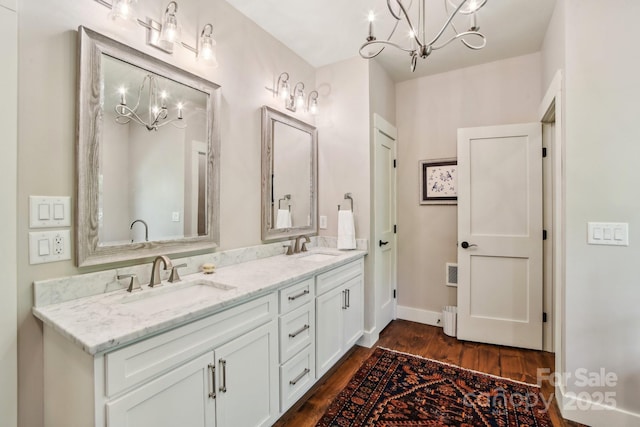 1092 E Bald Rock Dr, Sapphire, NC 28774 - full bathroom with a chandelier, double vanity, and wood finished floors