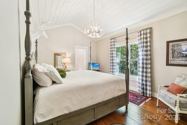 1092 E Bald Rock Dr, Sapphire, NC 28774 - bedroom with a chandelier, dark wood-style floors, vaulted ceiling, and wooden ceiling