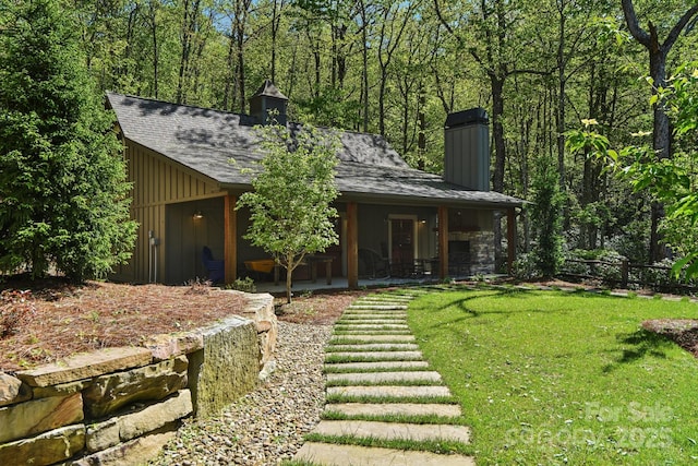 1092 E Bald Rock Dr, Sapphire, NC 28774 - back of house with a chimney, board and batten siding, a shingled roof, and a porch