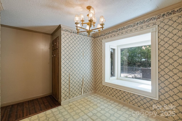 630 Burrage Rd NE, Concord, NC 28025 - unfurnished dining area with tile patterned floors, a chandelier, ornamental molding, and a textured ceiling
