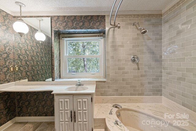 630 Burrage Rd NE, Concord, NC 28025 - bathroom with ornamental molding, a textured ceiling, wallpapered walls, vanity, and a shower