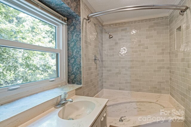 630 Burrage Rd NE, Concord, NC 28025 - full bath with vanity, a textured ceiling, shower / washtub combination, and crown molding