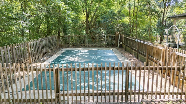 630 Burrage Rd NE, Concord, NC 28025 - view of swimming pool featuring a fenced backyard