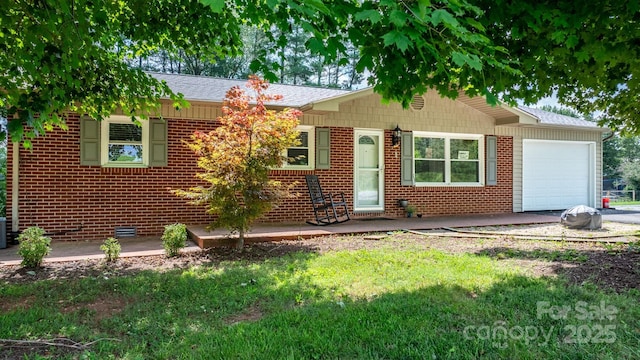 309 Sheldon St, Hudson, NC 28638 - ranch-style house with a garage, brick siding, roof with shingles, a front lawn, and asphalt driveway