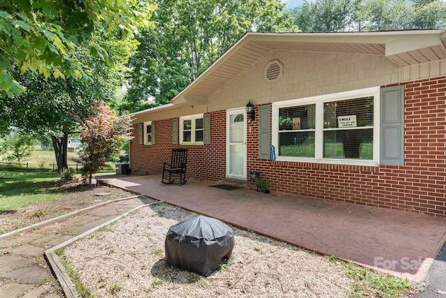 309 Sheldon St, Hudson, NC 28638 - bungalow-style home with a patio and brick siding