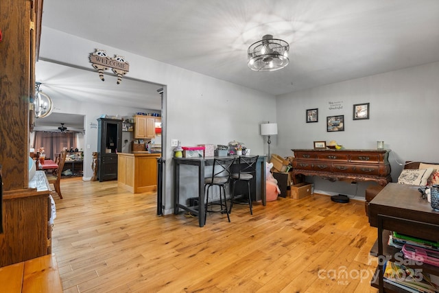 309 Sheldon St, Hudson, NC 28638 - interior space featuring light wood-style floors, a chandelier, and a ceiling fan