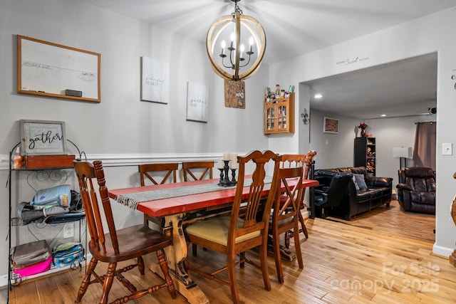 309 Sheldon St, Hudson, NC 28638 - dining area with a chandelier and light wood-style flooring