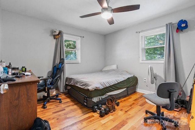 309 Sheldon St, Hudson, NC 28638 - bedroom with wood finished floors, an office area, and ceiling fan