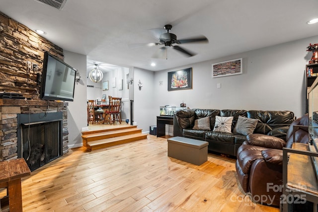 309 Sheldon St, Hudson, NC 28638 - living room featuring ceiling fan, wood finished floors, recessed lighting, and a stone fireplace