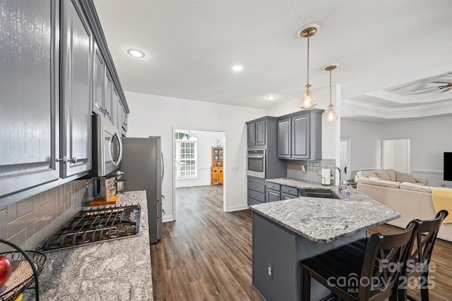 1528 Autumn Brook Ln, York, SC 29745 - kitchen featuring appliances with stainless steel finishes, gray cabinets, tasteful backsplash, dark wood finished floors, and recessed lighting