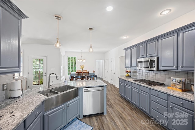 1528 Autumn Brook Ln, York, SC 29745 - kitchen featuring appliances with stainless steel finishes, dark wood-style flooring, decorative backsplash, light stone counters, and recessed lighting