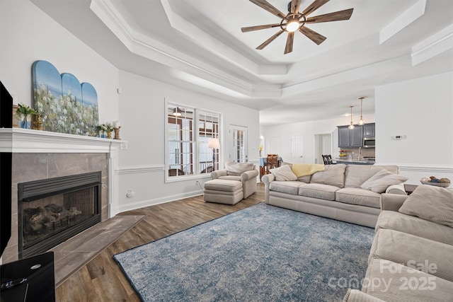 1528 Autumn Brook Ln, York, SC 29745 - living room with a tray ceiling, ceiling fan, wood finished floors, and a fireplace