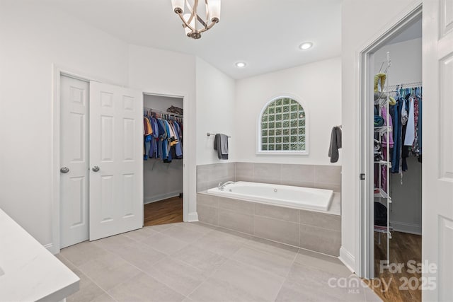 1528 Autumn Brook Ln, York, SC 29745 - bathroom with a garden tub, a walk in closet, and tile patterned flooring