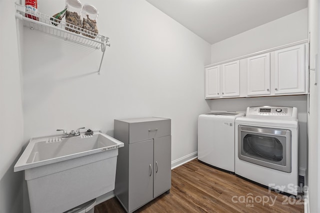 1528 Autumn Brook Ln, York, SC 29745 - laundry area featuring washing machine and dryer, cabinet space, and dark wood-style floors