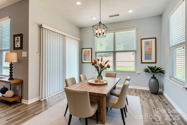 5237 Afterglow Ave, Concord, NC 28025 - dining space featuring light wood-type flooring, a chandelier, and recessed lighting