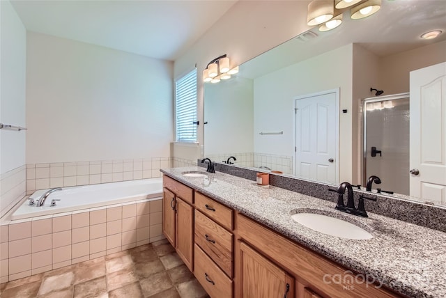 5237 Afterglow Ave, Concord, NC 28025 - full bathroom featuring a garden tub, double vanity, and a stall shower