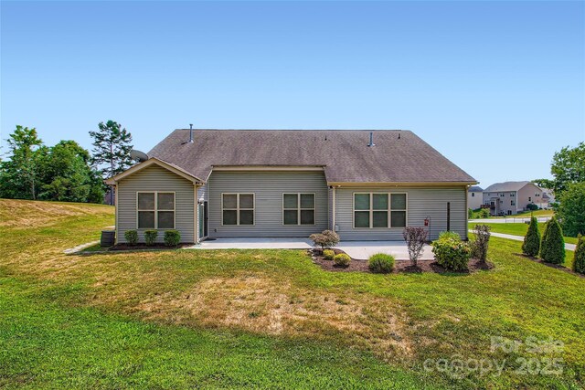 5237 Afterglow Ave, Concord, NC 28025 - back of house featuring a patio and a lawn