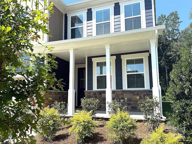9945 Cask Way, Huntersville, NC 28078 - property entrance featuring covered porch and stone siding