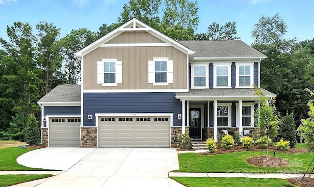 9945 Cask Way, Huntersville, NC 28078 - craftsman inspired home with concrete driveway, a front lawn, a porch, stone siding, and board and batten siding
