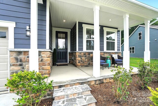 9945 Cask Way, Huntersville, NC 28078 - doorway to property with a porch and stone siding