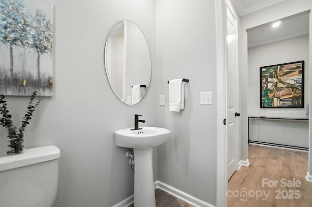 9945 Cask Way, Huntersville, NC 28078 - half bathroom featuring wood finished floors and ornamental molding