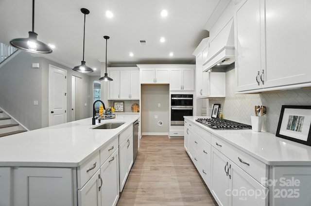 9945 Cask Way, Huntersville, NC 28078 - kitchen featuring stainless steel appliances, light wood-type flooring, premium range hood, light countertops, and recessed lighting