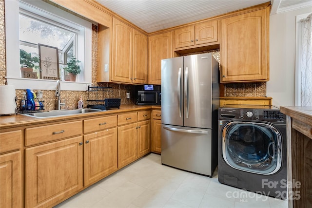 143 W College St, Stanley, NC 28164 - kitchen with freestanding refrigerator, washer / dryer, backsplash, black microwave, and light tile patterned flooring