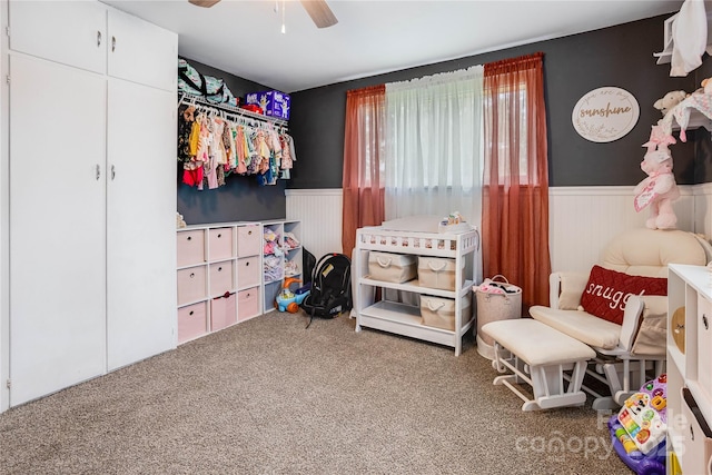 143 W College St, Stanley, NC 28164 - bedroom with wainscoting, carpet, and a ceiling fan