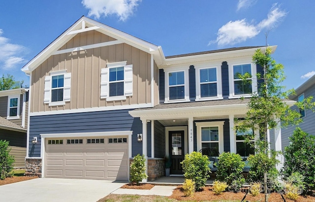 9843 Quercus Ln, Huntersville, NC 28078 - view of front of home with board and batten siding, concrete driveway, a garage, and a porch