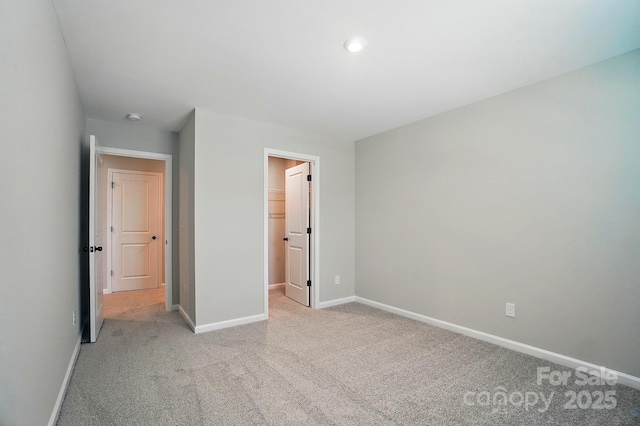 9843 Quercus Ln, Huntersville, NC 28078 - unfurnished bedroom with light carpet and a walk in closet