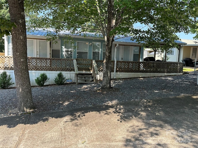 104 Pine St Unit 201, New London, NC 28127 - manufactured / mobile home featuring a metal roof and a porch