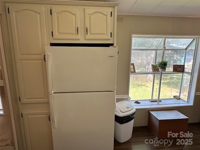 104 Pine St Unit 201, New London, NC 28127 - kitchen featuring freestanding refrigerator, ornamental molding, dark wood-style floors, and white cabinetry