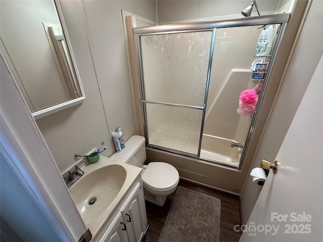 104 Pine St Unit 201, New London, NC 28127 - full bathroom featuring bath / shower combo with glass door, wood finished floors, and vanity